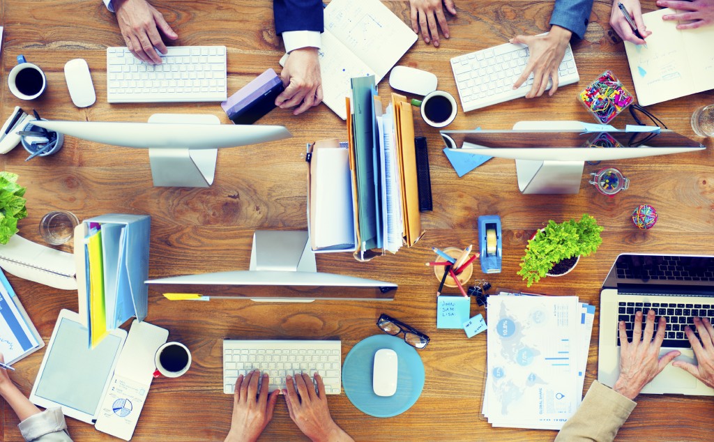 Group of Business People Working on an Office Desk